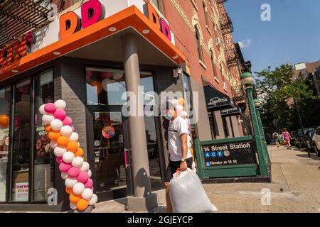 A spanking brand new Dunkin’, née Dunkin’ Donuts franchise opens its doors in Chelsea in New York, seen on on Wednesday, August 25, 2021.  (© Richard B. Levine) Stock Photo