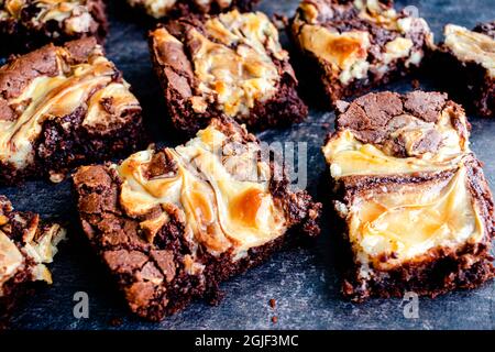 Brownies Topped with a Cream Cheese Swirl: Closeup view of freshly baked brownies swirled with cream cheese Stock Photo