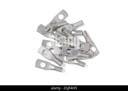 Handful of tinned copper electrical lugs for wiring electrical circuits isolated on white Stock Photo