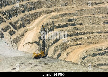 Blasthole drill in an open pit copper mine operation in Chile Stock Photo