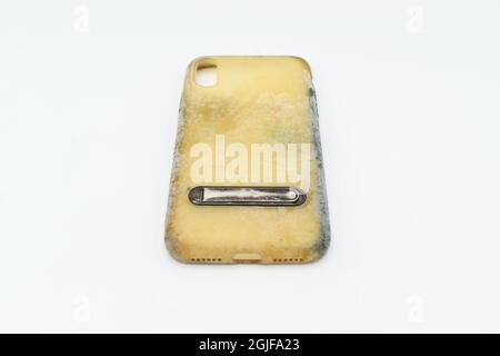 Old and dirty silicon phone case due to yellow stains and mold ...
