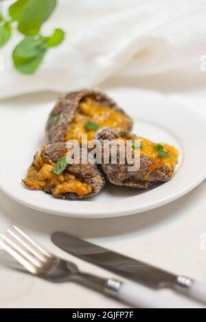 Stuffed Parasol Mushroom on white plate Stock Photo