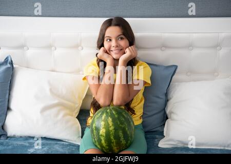 happy child hold fresh ripe water melon fruit, childhood Stock Photo