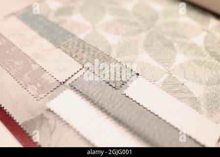 Closeup of samples of upholstery fabrics in store Stock Photo