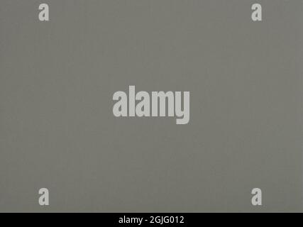 Medium grey paper background. Greenish grey colour paper texture. Stock Photo