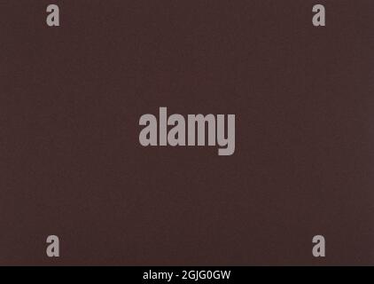 Dark brown paper background. Woody brown colour paper texture. Stock Photo
