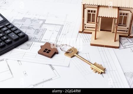 calculating the construction of the house, the layout of the house on the drawings, the cost of construction turnkey Stock Photo