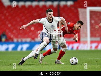 Arkadiusz Milik of Poland battles with Declan Rice of England during England v Poland football match Stock Photo