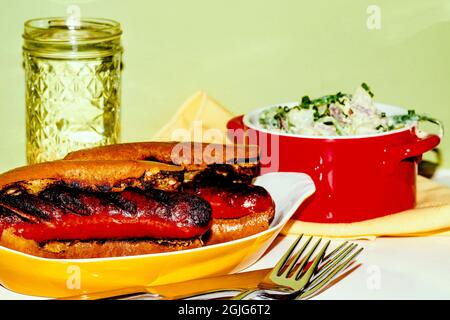 Char-grilled kielbasa sausage sub sandwich with green goddess dressing potato salad Stock Photo