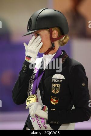 Hagen A.T.W., Germany. 09th Sep, 2021. Equestrian sport: European Championship, Dressage. Dressage rider Jessica von Bredow-Werndl (Germany) wins the gold medal on TSF Dalera BB and is European Champion. Credit: Friso Gentsch/dpa/Alamy Live News Stock Photo
