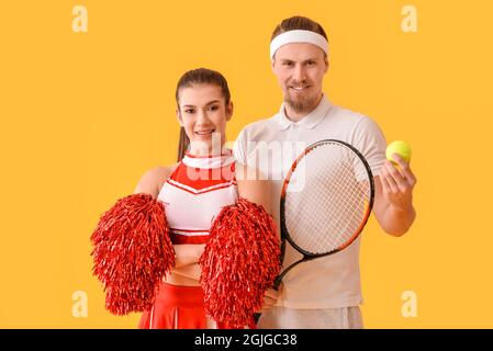 Cheerleader and tennis player on color background Stock Photo
