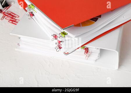 Stack of folders with documents on table Stock Photo