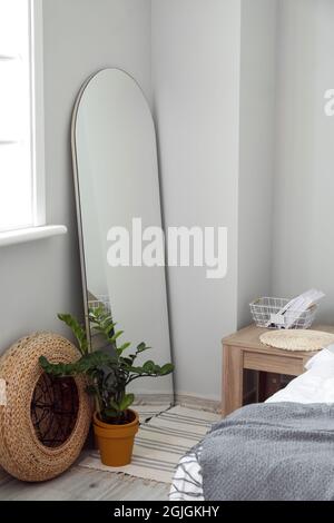 Mirror in interior of stylish bedroom Stock Photo