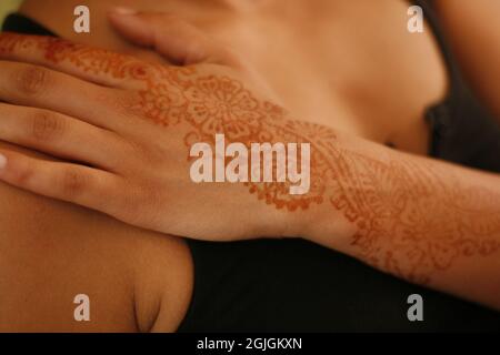 Henna tattoo at a summer wedding Stock Photo