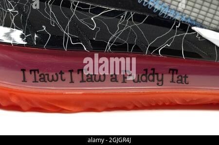 Detailed view of a quote 'I Tawt I Taw a Puddy Tat'  by Looney Tunes character Tweety Bird on the Air Max unit on a Nike LeBron 18 low limited edition Stock Photo