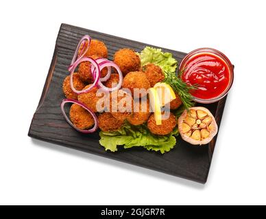 Board with tasty cod cutlets and sauce on white background Stock Photo