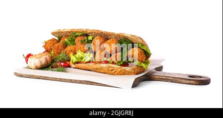Board with bread and tasty cod cutlets on white background Stock Photo