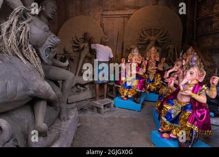 Kolkata, India. 09th Sep, 2021. Idols of elephant-headed Hindu God Ganesha are being prepared and put up for sale at Kumartuli, the Artisans hub of Kolkata, India on Sept. 9, 2021. Ganesh Chaturthi, which will be observed on the 10th of this month. According to Hindu Treatise Ganesha is considered as the lord of prosperity. Besides a few households, in Kolkata mainly the big and small business owners observe this festival in grandeur and rush on the potters' studio looking for the perfect idol. (Photos by Sourojeet Paul/Sipa Usa) Credit: Sipa USA/Alamy Live News Stock Photo