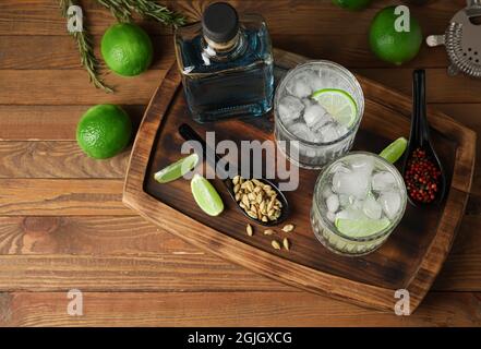 Glasses of cold gin and tonic on wooden background Stock Photo