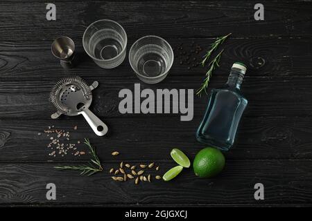 Frame made of glasses and ingredients for gin tonic on dark background Stock Photo
