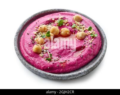 plate of beetroot hummus isolated on white background Stock Photo