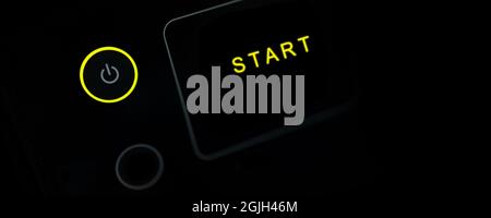 Close up of yellow power button, Start up business concept, Black banner background Stock Photo