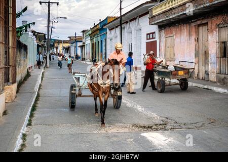 Horse and cart, and pushcart, on the street in Sancti Spiritus, Cuba Stock Photo