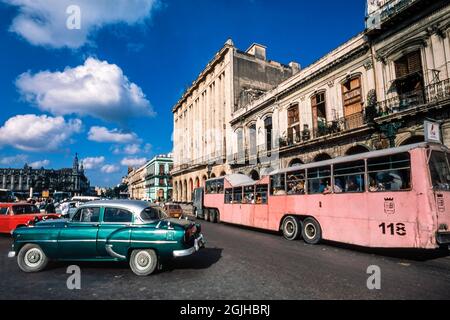 Classic American car and Russian lorry converted to bus, central Havana, Cuba Stock Photo