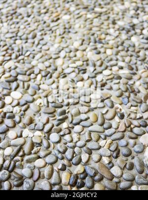 Natural cobblestone old stone road. Beautiful background. Stock Photo