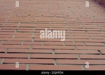 Red brick wall close-up. The outer wall of the building in a rec Stock Photo