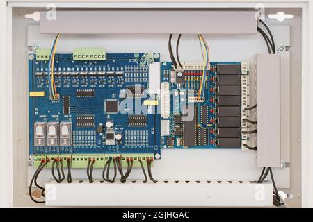 Digital electronic circuit board inside weather proof box, imbedded system for automatic working in agriculture field. Stock Photo