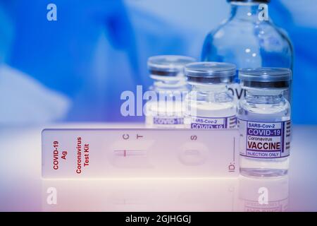 Covid-19 Self Rapid Antigen Test Kit with Covid Vaccine dose bottle for Coronavirus detect and treatment. Stock Photo