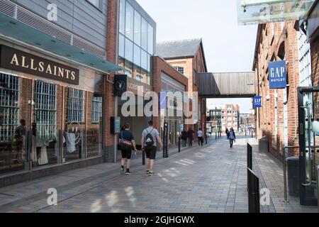 Gloucester Quays shopping centre with Allsaints and The Gap in the UK Stock Photo