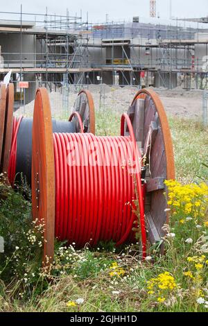 Huge spools  with  cables for the construction industry to connect new built houses Stock Photo