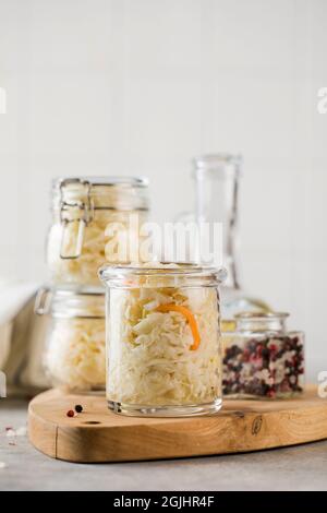 Sauerkraut in glass jars. Fermentation and canning of vegetables. Stock Photo