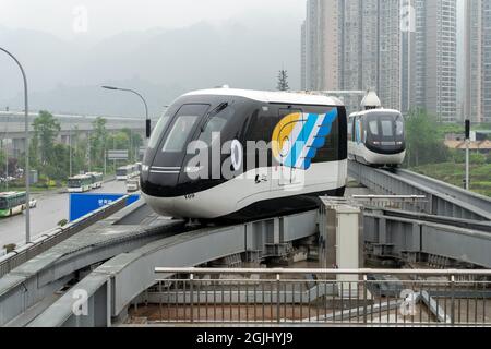 CHONGQING, CHINA - Apr 17, 2021: A Chinese newly made self-driving unmanned light rail named as sky shuttle operated for the first time Stock Photo