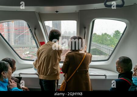 Chongqing,China-April 17 2021: Chinese newly made self-driving unmanned light rail named as skyshuttle operated for the first time with advanced BYD b Stock Photo