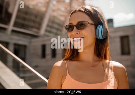 A cute young woman having good time outside on weekend Stock Photo