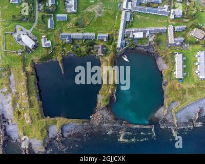 Drone view of flooded slate quarries on Easdale Island on one of the slate islands, Argyll and Bute, Scotland, UK Stock Photo