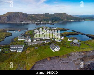 Aerial view from drone of slate islands with Easdale Island front and Ellenabeich village on Seil Island in distance, Argyll and Bute, Scotland, UK Stock Photo