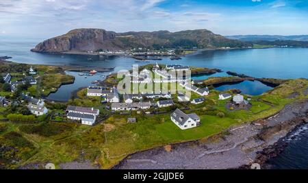 Aerial view from drone of slate islands with Easdale Island front and Ellenabeich village on Seil Island in distance, Argyll and Bute, Scotland, UK Stock Photo