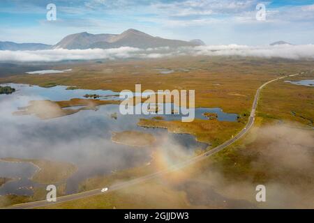 Early morning view of Rannoch Moor and A82 road  in the mist from drone, Scottish highlands, Scotland, UK Stock Photo