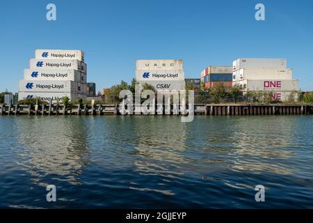 Shipping containers stacked up at Eling Wharf on Southampton Water, Hampshire, England, UK Stock Photo