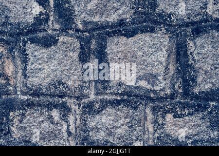 Old Temple wall. Rectangular cut out marble granite brick real surface stone with cement. Pattern gray color rustic texture background. Design website Stock Photo