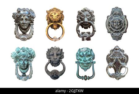 Set of isolated door knockers, gold lion head with the ring on its mouth, antique head and italian traditional doorknobs on white background.  Old orn Stock Photo