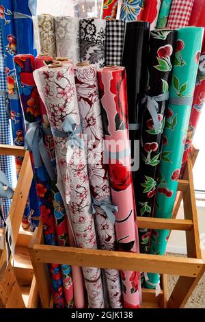 Bolts of oil cloth like colorful fabrics at the Treadle Fabric Shop. St Paul Minnesota MN USA Stock Photo