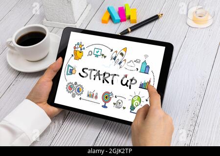 Business woman holding tablet PC in hand, support startup company, business success concept Stock Photo