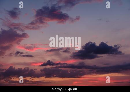 Beautiful colored cloudy evening sky. Sky with clouds at sunset. Abstract sky background. Stock Photo