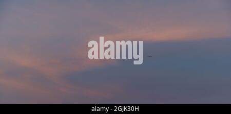 Beautiful colored cloudy evening sky. Sky with clouds at sunset. Abstract sky background. Stock Photo