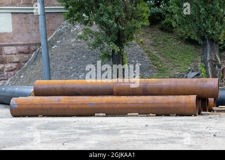 Big rusty water pipes on construction site Stock Photo